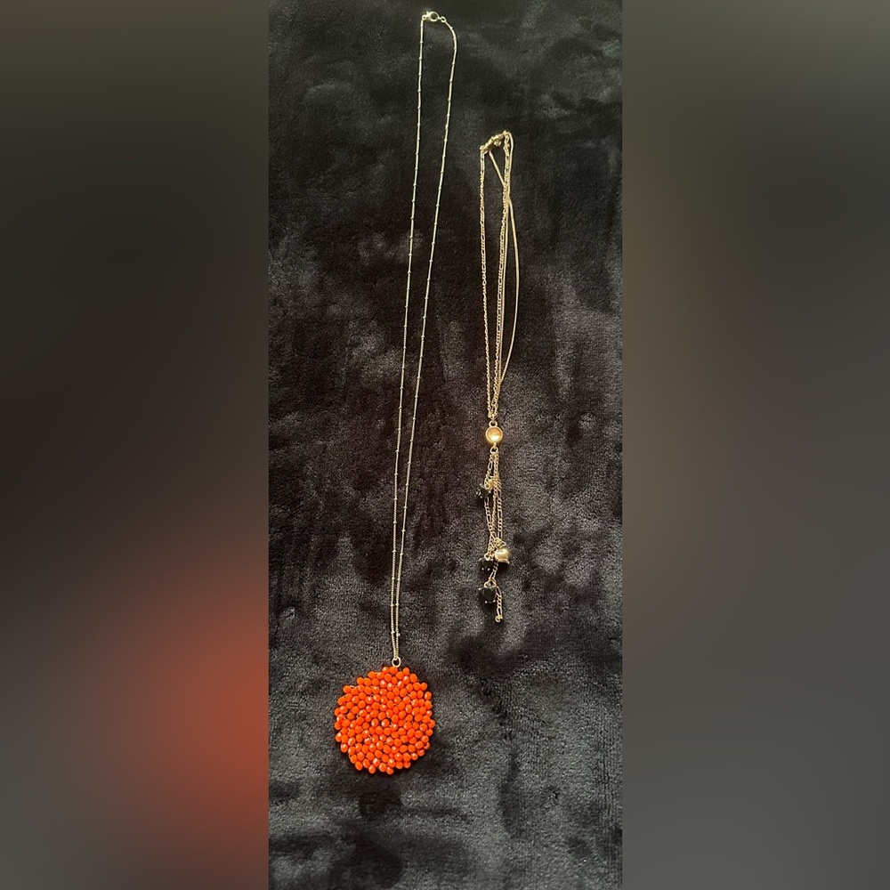 2 Necklaces
Orange Beaded Center Piece 
& Elegant Gold and Black Charm